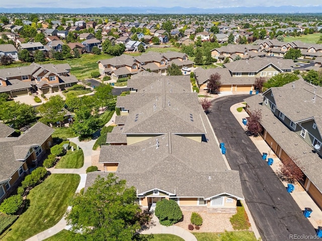 3662 S Perth Cir Unit 104, Aurora, CO 80013 - aerial view of property and surrounding area featuring nearby suburban area and mountains