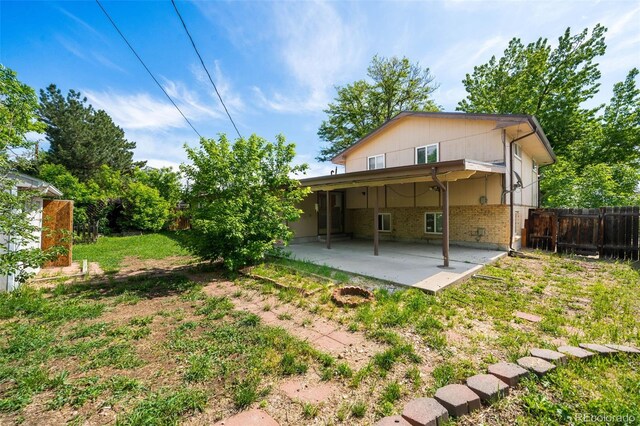 6953 Ingalls St, Arvada, CO 80003 - back of house featuring brick siding and a patio area