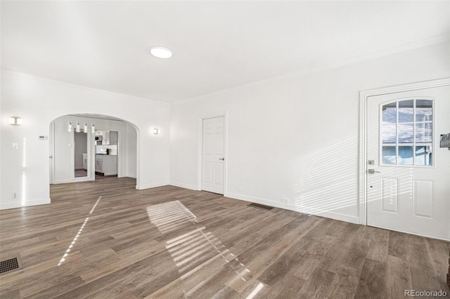 unfurnished living room featuring hardwood / wood-style floors