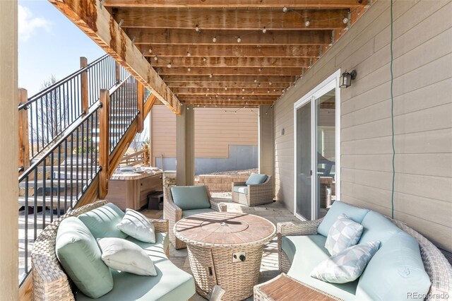 view of patio with stairs and outdoor lounge area