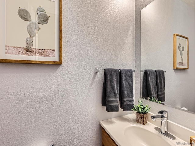 6065 Wadsworth Blvd Unit A, Arvada, CO 80003 - bathroom with vanity and a textured wall