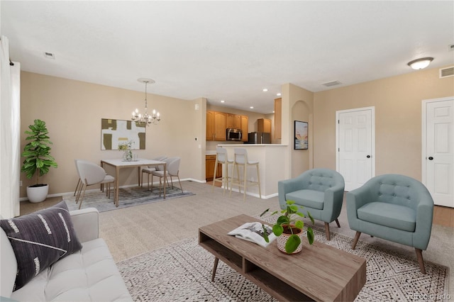12784 Jasmine St Unit E, Thornton, CO 80602 - living area featuring light carpet, a chandelier, and recessed lighting