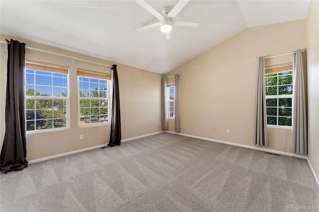12784 Jasmine St Unit E, Thornton, CO 80602 - carpeted spare room with vaulted ceiling, a ceiling fan, and plenty of natural light