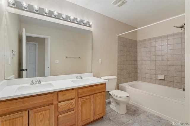 12784 Jasmine St Unit E, Thornton, CO 80602 - full bathroom featuring double vanity, shower / washtub combination, and tile patterned flooring
