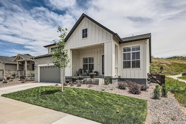 5668 Shadescale Way, Castle Rock, CO 80104 - view of front facade with covered porch, board and batten siding, and concrete driveway