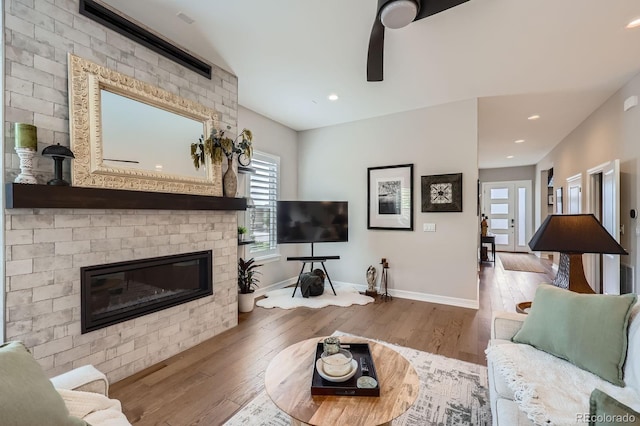 5668 Shadescale Way, Castle Rock, CO 80104 - living area with wood finished floors, a fireplace, and recessed lighting