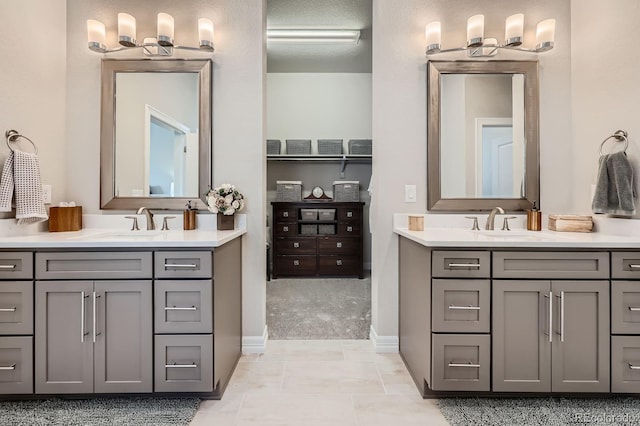 5668 Shadescale Way, Castle Rock, CO 80104 - full bathroom featuring two vanities and tile patterned flooring