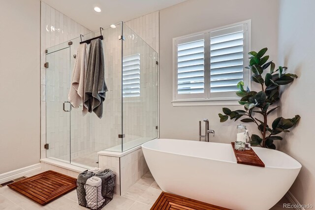 5668 Shadescale Way, Castle Rock, CO 80104 - full bath featuring a freestanding bath, a stall shower, and recessed lighting