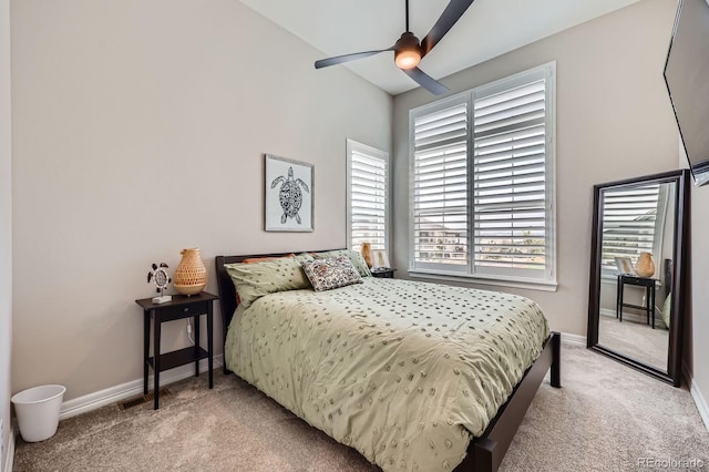 5668 Shadescale Way, Castle Rock, CO 80104 - bedroom featuring light colored carpet, multiple windows, and a ceiling fan