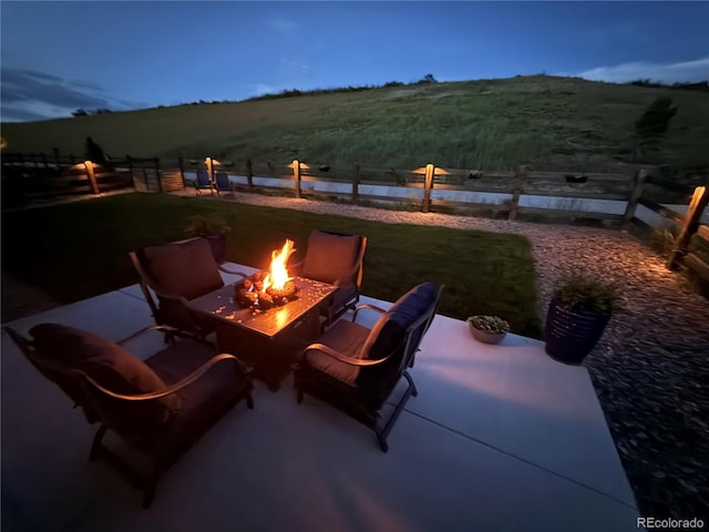 5668 Shadescale Way, Castle Rock, CO 80104 - view of patio / terrace with an outdoor fire pit and a water view