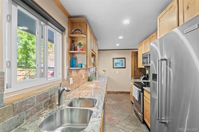 kitchen with decorative backsplash, appliances with stainless steel finishes, light stone counters, crown molding, and sink