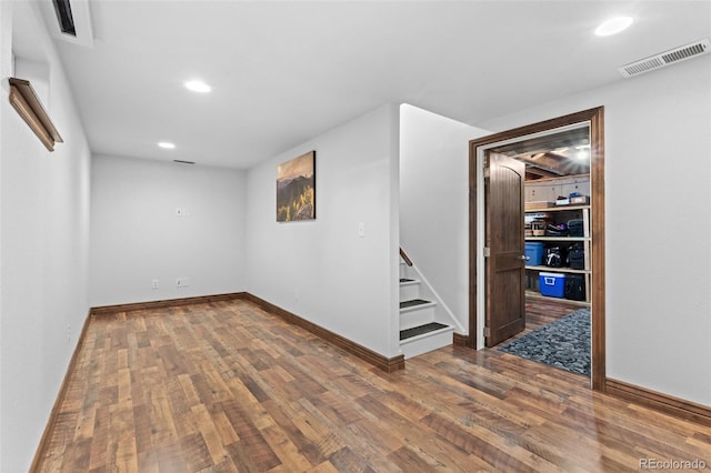 spare room with hardwood / wood-style flooring