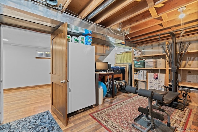 basement with hardwood / wood-style flooring