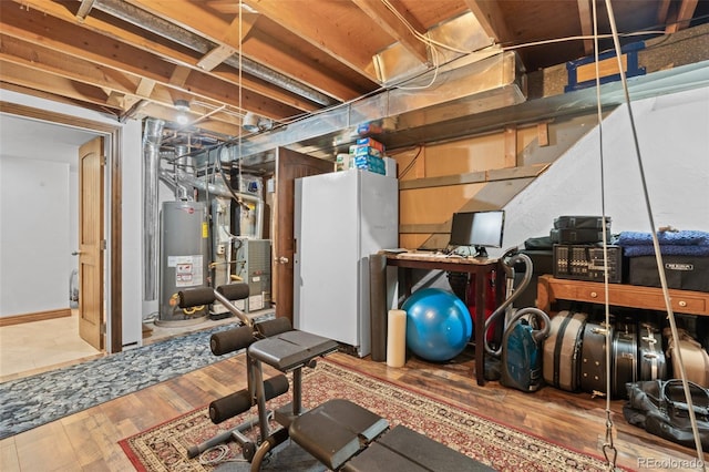 interior space featuring hardwood / wood-style floors and water heater