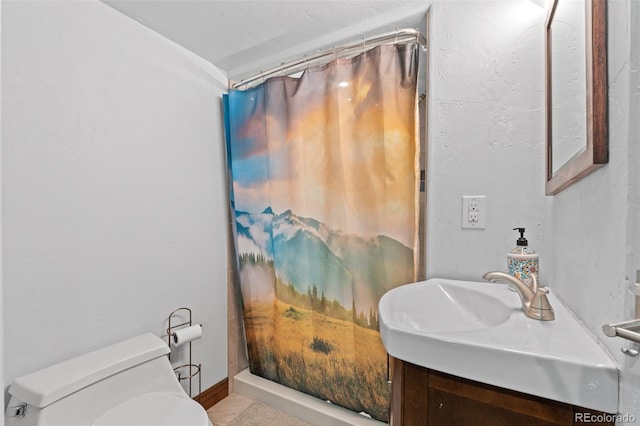 bathroom featuring walk in shower, vanity, and toilet