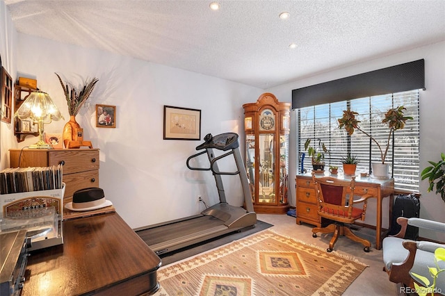 carpeted home office with recessed lighting and a textured ceiling