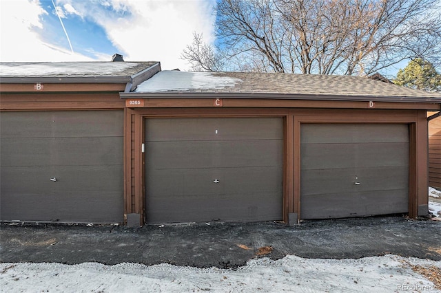 view of snow covered garage