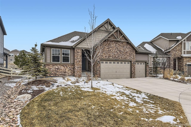 craftsman house with stone siding, an attached garage, and concrete driveway