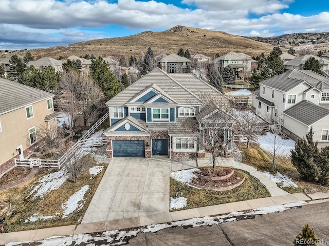 drone / aerial view featuring a mountain view