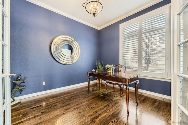 office area with a wealth of natural light, dark hardwood / wood-style floors, ornamental molding, and a notable chandelier