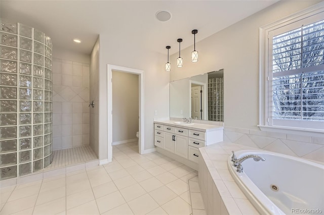 full bathroom featuring vanity, toilet, tile patterned floors, and plus walk in shower