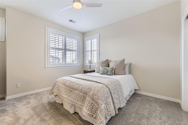 carpeted bedroom with ceiling fan