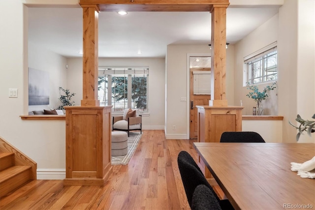 interior space with a wealth of natural light and light hardwood / wood-style flooring