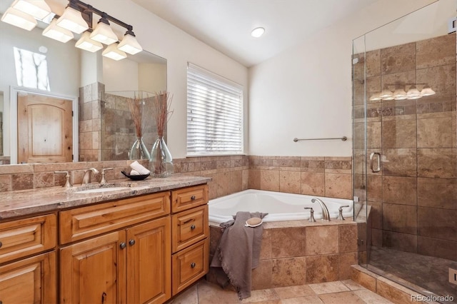 bathroom with separate shower and tub and vanity