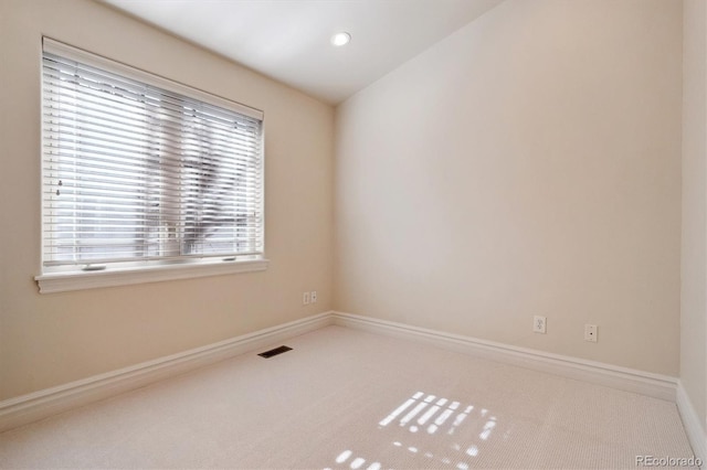 spare room with carpet floors