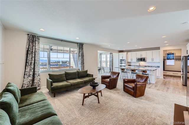 living room with light hardwood / wood-style floors