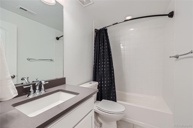 full bathroom featuring vanity, tile patterned flooring, toilet, and shower / bath combo