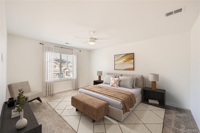 bedroom with ceiling fan and light colored carpet