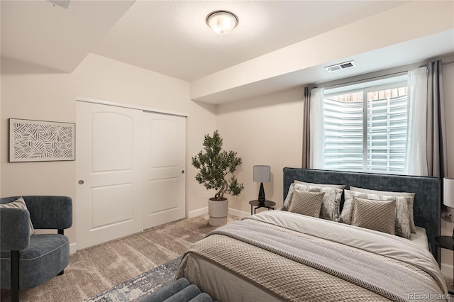 carpeted bedroom featuring a closet