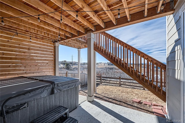 view of patio / terrace with a hot tub