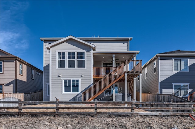 back of house with ceiling fan