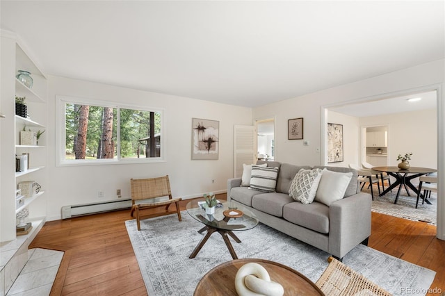133 Mine Ln, Boulder, CO 80302 - living room featuring a baseboard heating unit and hardwood / wood-style floors