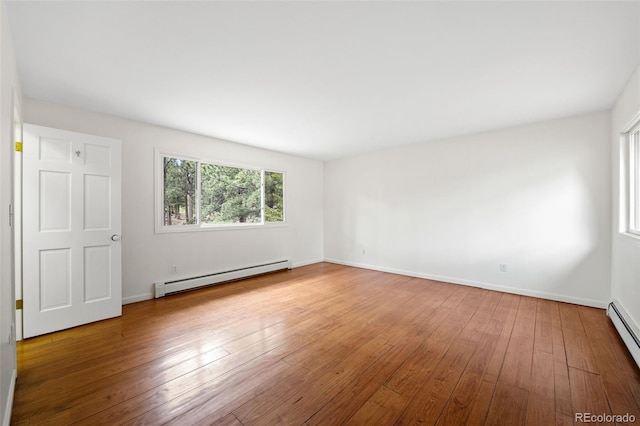 133 Mine Ln, Boulder, CO 80302 - unfurnished room with a baseboard radiator and hardwood / wood-style floors