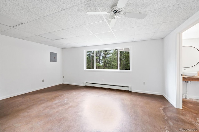 133 Mine Ln, Boulder, CO 80302 - spare room with baseboard heating, finished concrete flooring, electric panel, a drop ceiling, and ceiling fan