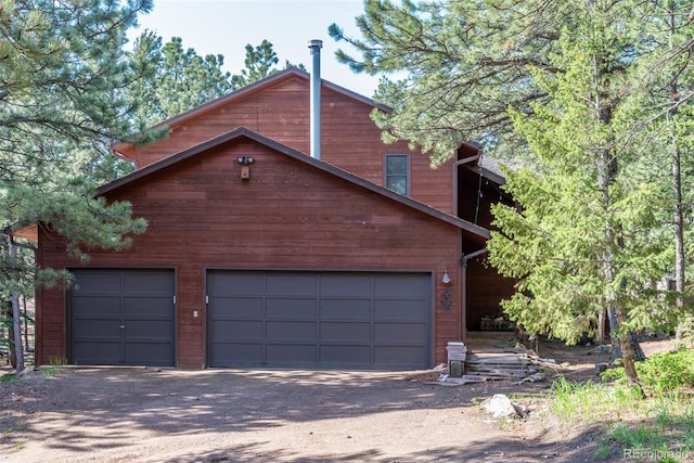 133 Mine Ln, Boulder, CO 80302 - rustic home featuring driveway and a garage