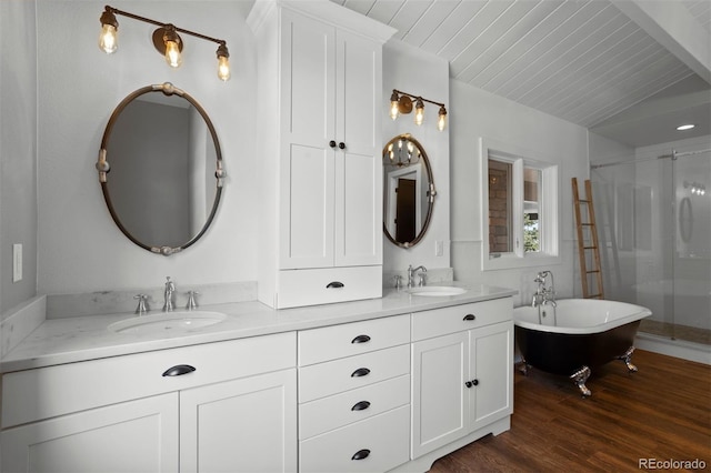 bathroom featuring vanity, shower with separate bathtub, hardwood / wood-style floors, and beam ceiling