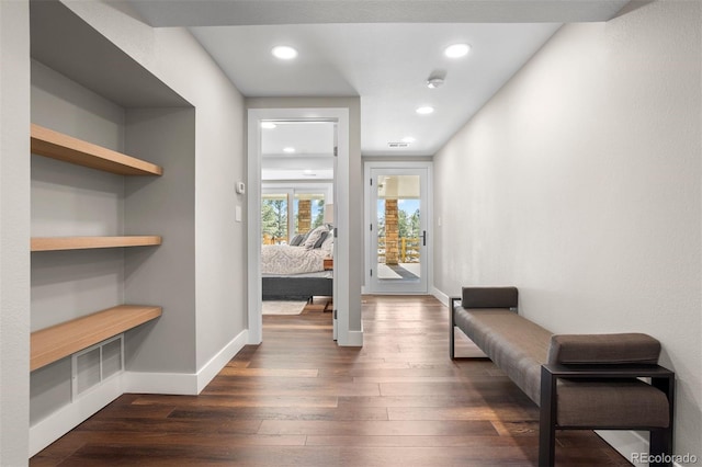 corridor featuring dark hardwood / wood-style floors