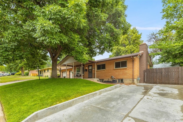 2876 S Wolff St, Denver, CO 80236 - ranch-style house with a porch, brick siding, and a chimney