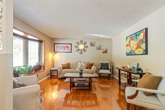 2876 S Wolff St, Denver, CO 80236 - living area with a textured ceiling and light wood-style floors
