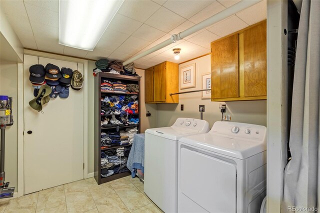 2876 S Wolff St, Denver, CO 80236 - laundry area featuring cabinet space and washing machine and dryer