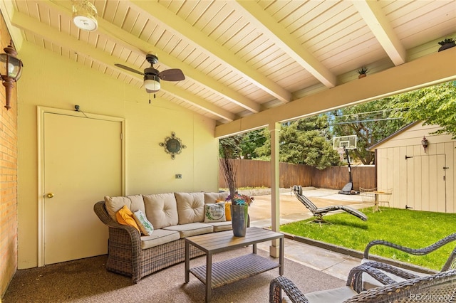2876 S Wolff St, Denver, CO 80236 - fenced backyard featuring a patio area, a storage unit, an outdoor hangout area, and ceiling fan