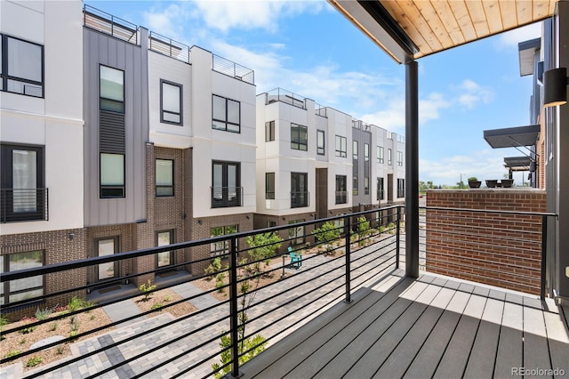 wooden terrace featuring a residential view