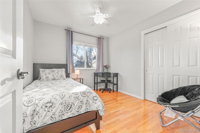 bedroom featuring wood-type flooring, a closet, and ceiling fan