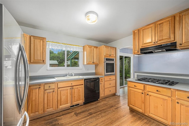 5502 E Center Ave, Denver, CO 80246 - kitchen featuring black appliances, under cabinet range hood, wood finished floors, and light countertops