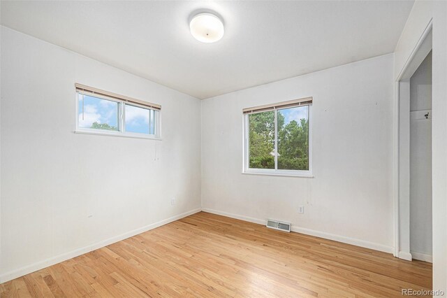 5502 E Center Ave, Denver, CO 80246 - unfurnished bedroom featuring light wood-style floors and baseboards