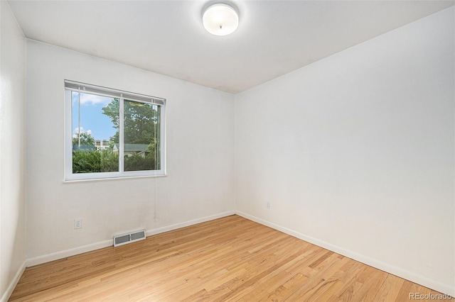5502 E Center Ave, Denver, CO 80246 - empty room with wood finished floors and baseboards
